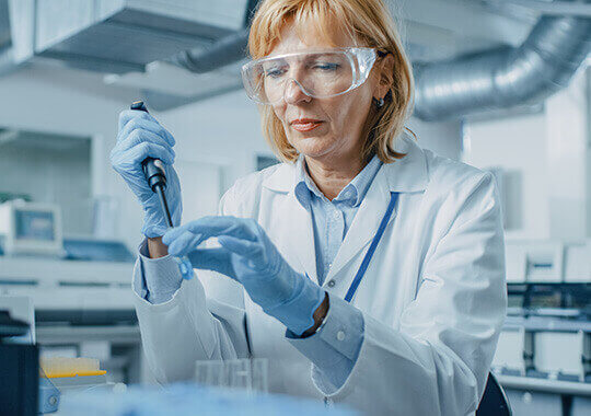Woman working in pharmaceutical laboratory